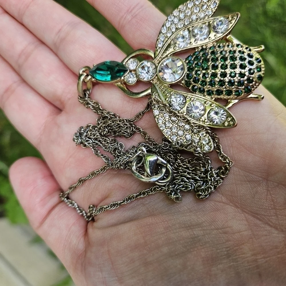 gold tone clear and green rhinestone bug pendant necklace